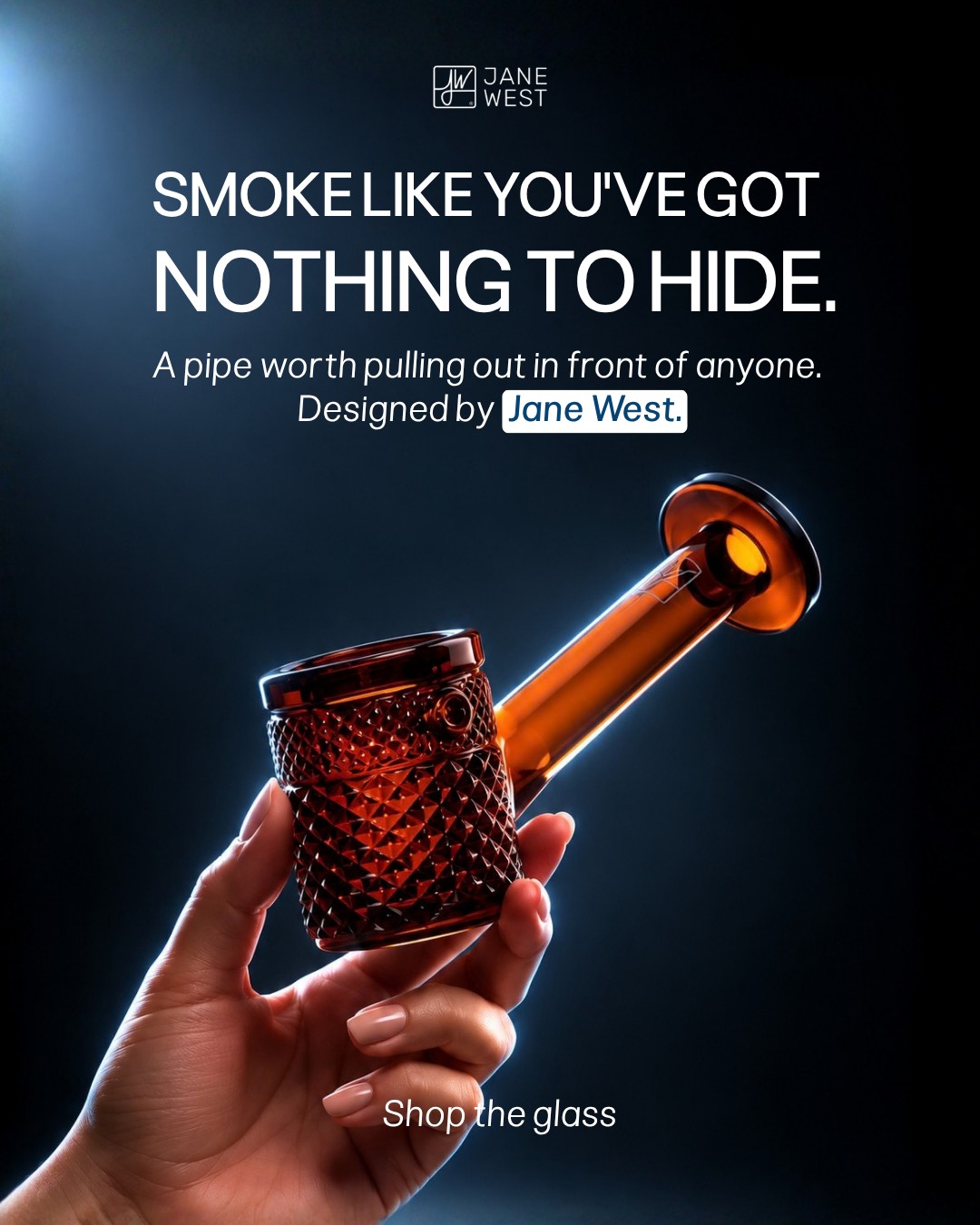 Design concept 1A: amber glass held up against a dark background